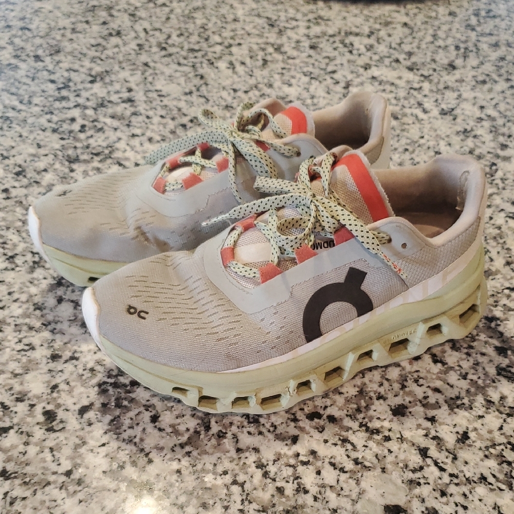 On Running Gray and Red Sneakers with Mesh Upper and Cushioned Midsole